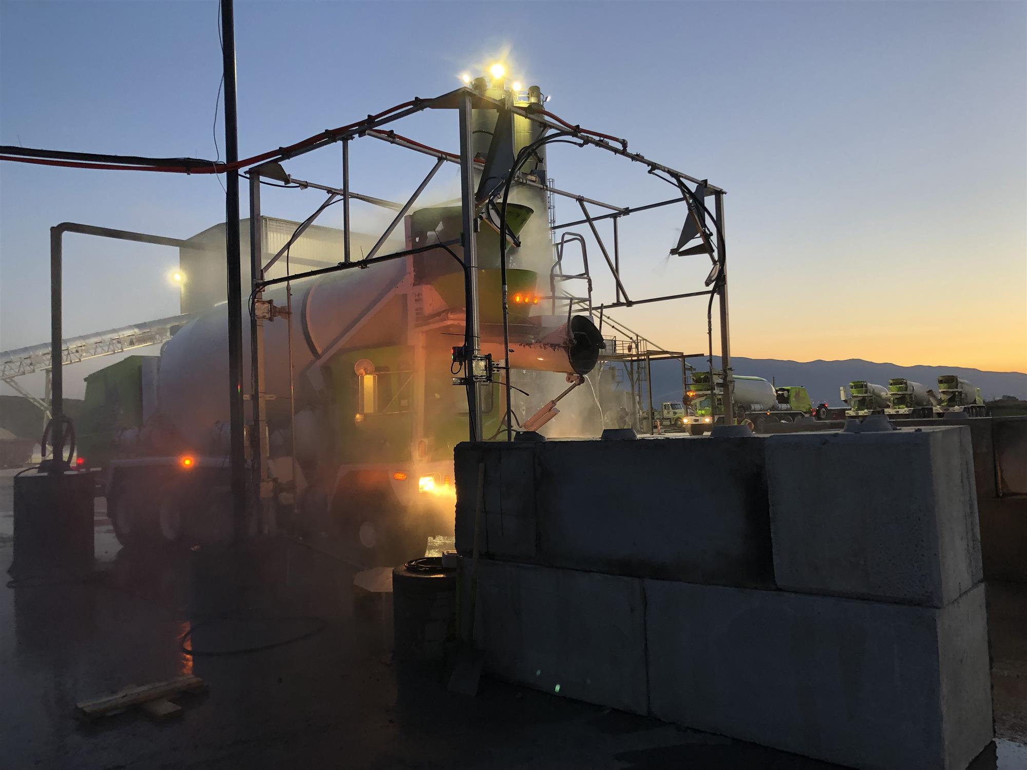 Sioux truck wash cleaning concrete trucks at dawn